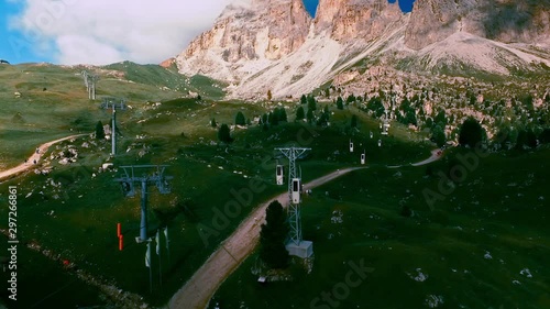 The Langkofel cable car brings hikers and climbers on the summit of the mountain, while other tourists stroll toward the city of stone (Citta dei sassi).