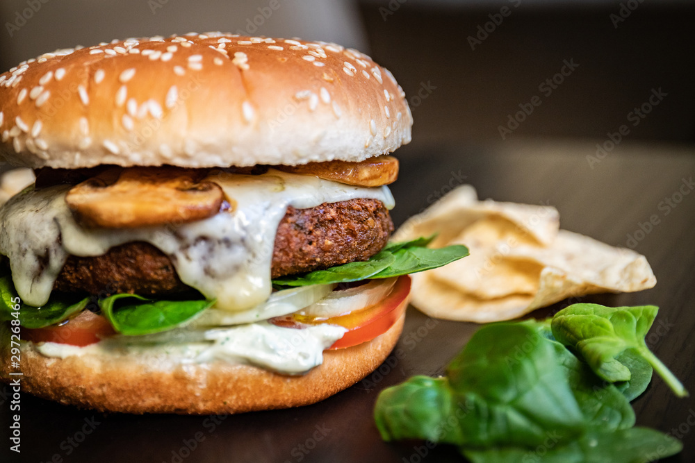 Delicious vegan falafel burger, cheese made from cassava and mushrooms. Healthy veggie vegetarian sandwich with no animal derivatives. Delicious vegan falafel burger, cheese made from cassava and mushrooms. Healthy veggie vegetarian sandwich with no animal derivatives.