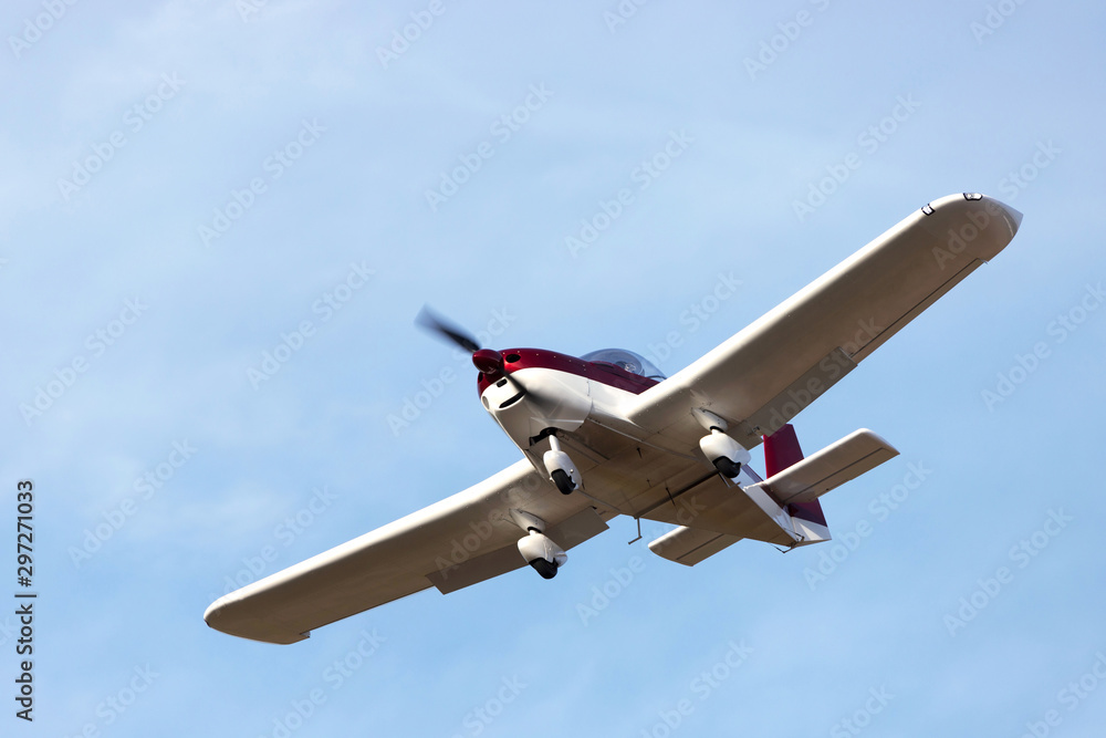 Obraz premium sports airplane flying mid air
