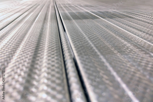 Texture of longitudinal metal profile with pattern, close-up background. Copy space