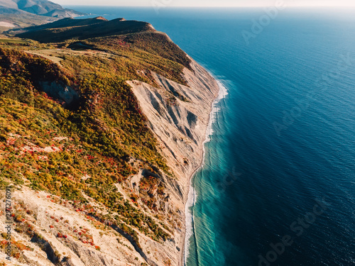 Aerial view of rocky cliff, coastline and sea with wave in Anapa photo