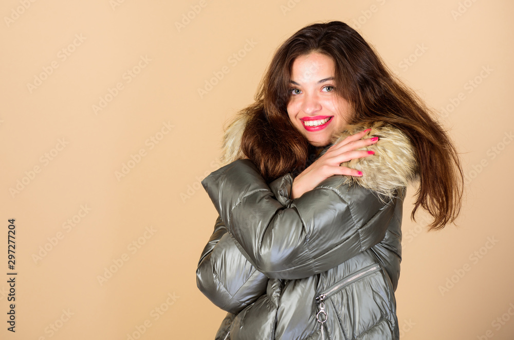Holyday atmosphere. woman in padded warm coat. girl in puffed coat. faux fur fashion. flu and cold. seasonal fashion. happy winter holidays. beauty in winter clothing. cold season shopping Holyday atmosphere. woman in padded warm coat. girl in puffed coat. faux fur fashion. flu and cold. seasonal fashion. happy winter holidays. beauty in winter clothing. cold season shopping