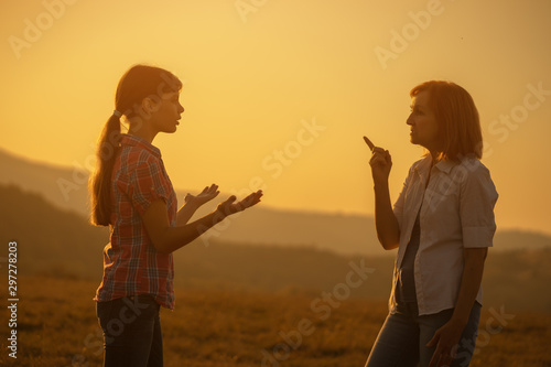 Foto Grandmother and granddaughter are arguing.