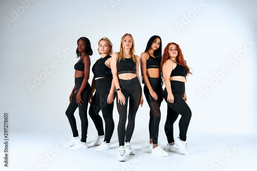 Models with diversuty in skin, hair. African, american, russian cheerful emotional posing on white background