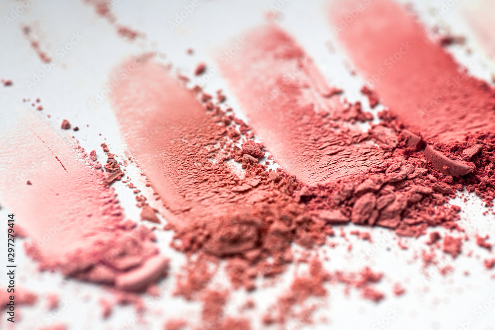 Crumbled blushes in different colors texture close-up, cosmetic pigments