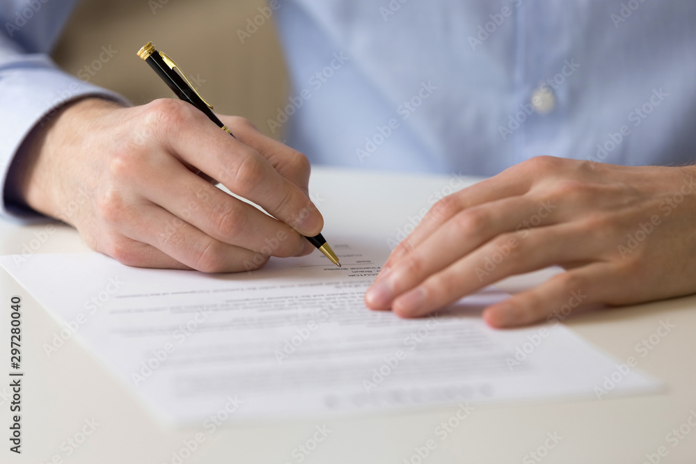 Successful male entrepreneur signing contract agreement, bank loan form. Successful male entrepreneur signing contract agreement, bank loan form.