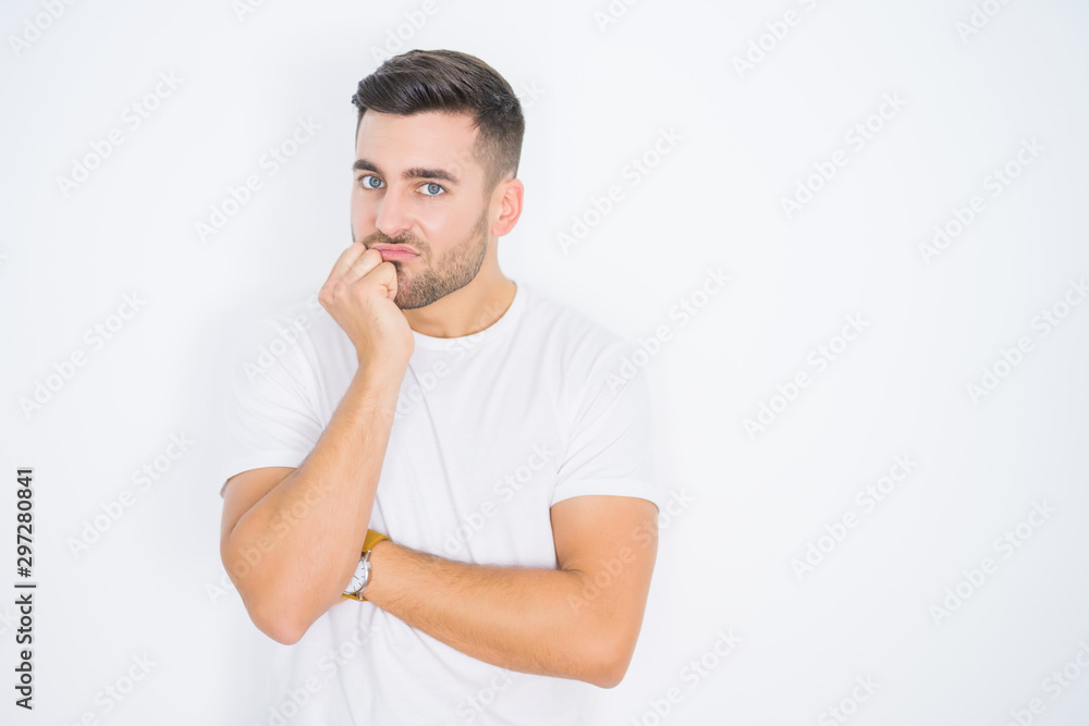Young handsome man wearing casual white t-shirt over white isolated background thinking looking tired and bored with depression problems with crossed arms. Young handsome man wearing casual white t-shirt over white isolated background thinking looking tired and bored with depression problems with crossed arms.