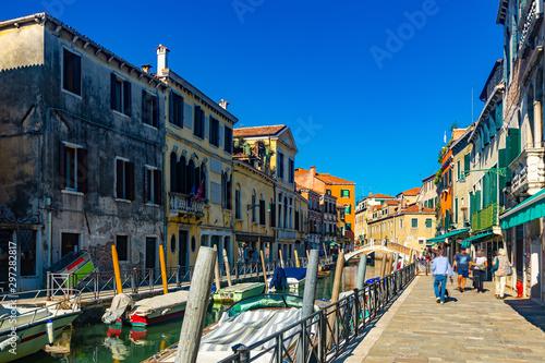 View of  canals and cityscape with colorful buildings in Venice