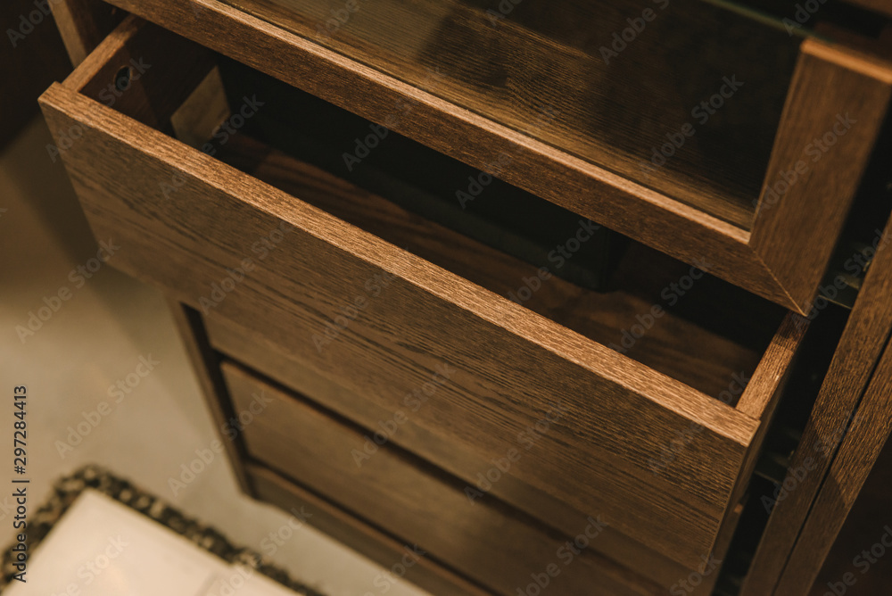 Wooden cupboard with opened empty drawer. Wooden cupboard with opened empty drawer.
