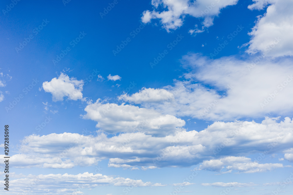Blue sky on a sunny day with fluffy clouds Blue sky on a sunny day with fluffy clouds