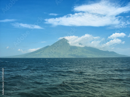 Ring of Fire Indonesia - Sangeang volcano island on the sea photo