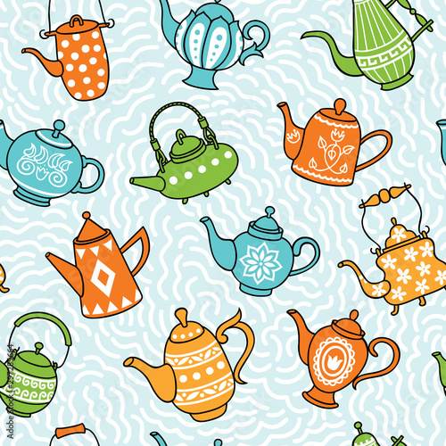 Photos Pattern from teapots on a blue background. Seamless pattern.