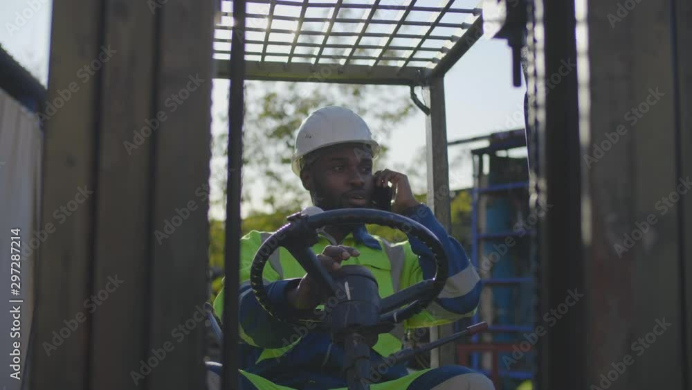 Industrial worker in loader truck Industrial worker in loader truck