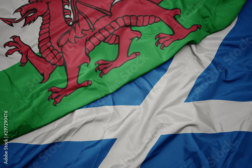 Foto waving colorful flag of scotland and national flag of wales.