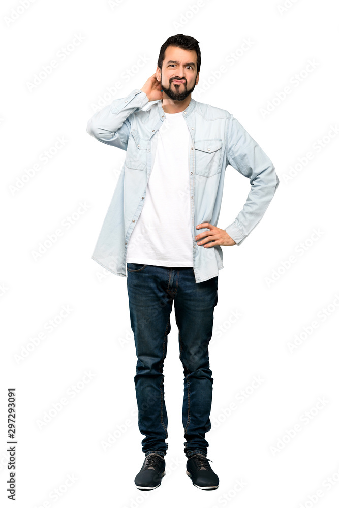 Full-length shot of Handsome man with beard having doubts over isolated white background Full-length shot of Handsome man with beard having doubts over isolated white background