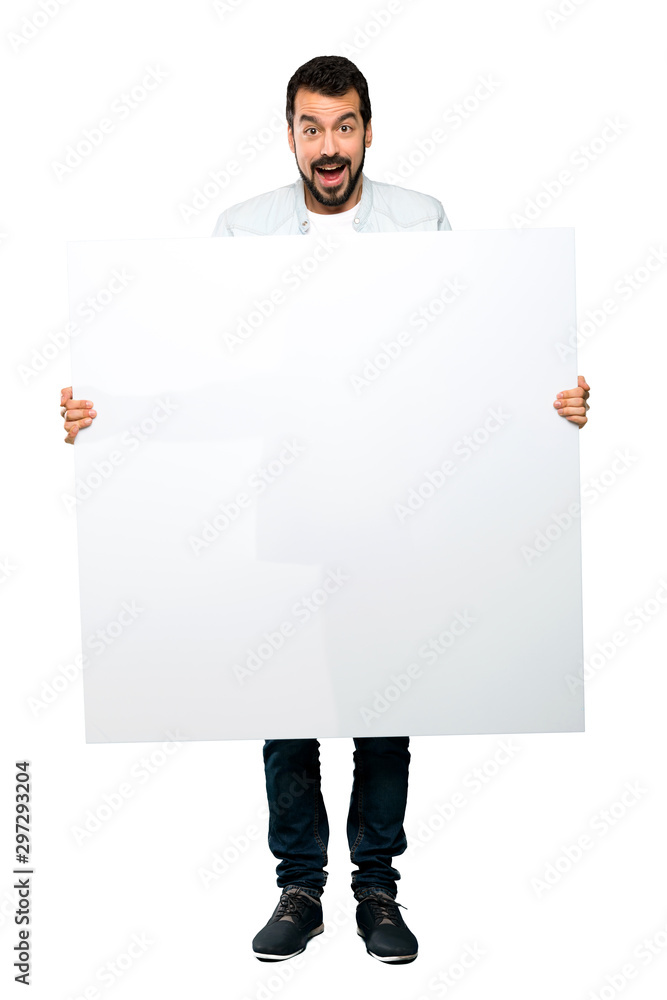 Handsome man with beard holding an empty placard Handsome man with beard holding an empty placard
