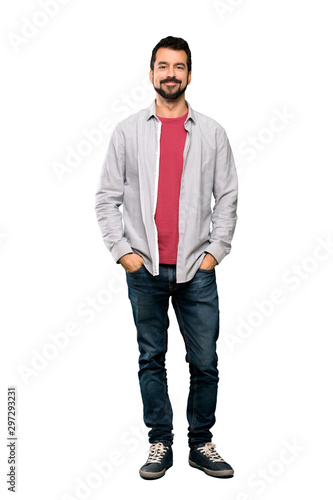 Fotografija Full-length shot of Handsome man with beard laughing over isolated white backgro