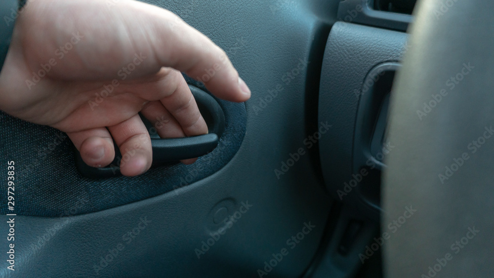 hand opens the car door