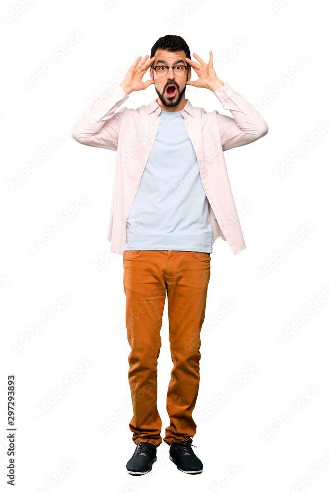 Full-length shot of Handsome man with beard with surprise expression over isolated white background Full-length shot of Handsome man with beard with surprise expression over isolated white background