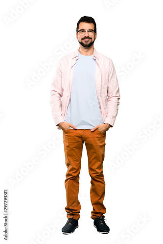 Full-length shot of Handsome man with beard laughing over isolated white background