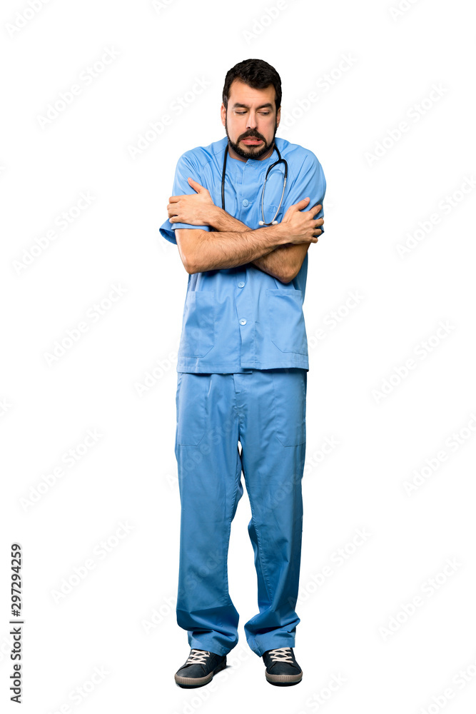 Full-length shot of Surgeon doctor man freezing over isolated white background Full-length shot of Surgeon doctor man freezing over isolated white background