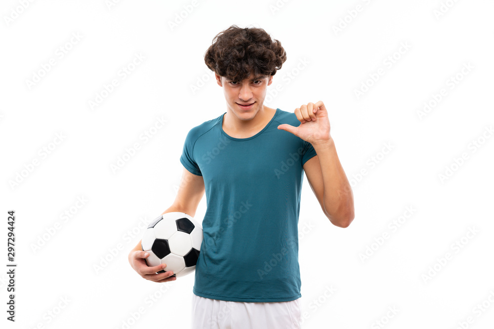Young football player man over isolated white wall proud and self-satisfied