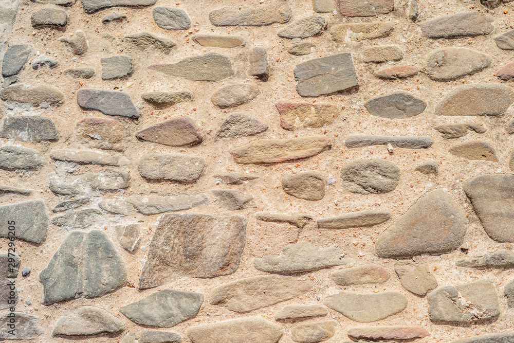 Irregular stones creating warm, natural background Irregular stones creating warm, natural background