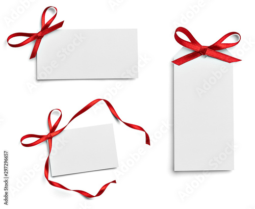 blank gift tag with red bow isolated on white background