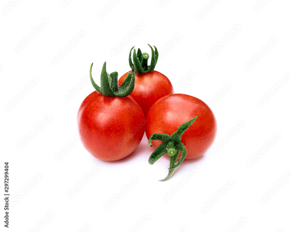 Small and fresh cherry tomatoes on a white background with a sunny shadow. Summer plant. Food product. Small and fresh cherry tomatoes on a white background with a sunny shadow. Summer plant. Food product.