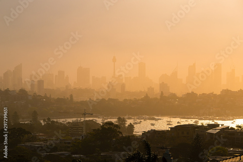 Canvas Print Foggy Sydney skyline under the warm sunlight.