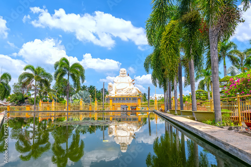 Architectural Specification biggest Maitreya Buddha merciful smile, bright white attracts many Buddhists to pray for peace. This is the beautiful architecture of Buddha in My Tho, Vietnam photo