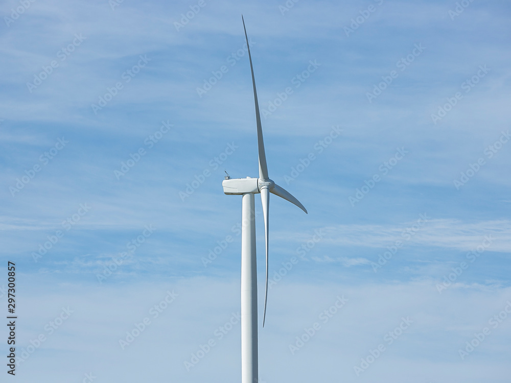 Close up of a large wind turbine moving to create kinetic energy for renewable energy supply on a cloudy day located southeast of Lake George and north of Bungendore in New South Wales, Australia Close up of a large wind turbine moving to create kinetic energy for renewable energy supply on a cloudy day located southeast of Lake George and north of Bungendore in New South Wales, Australia