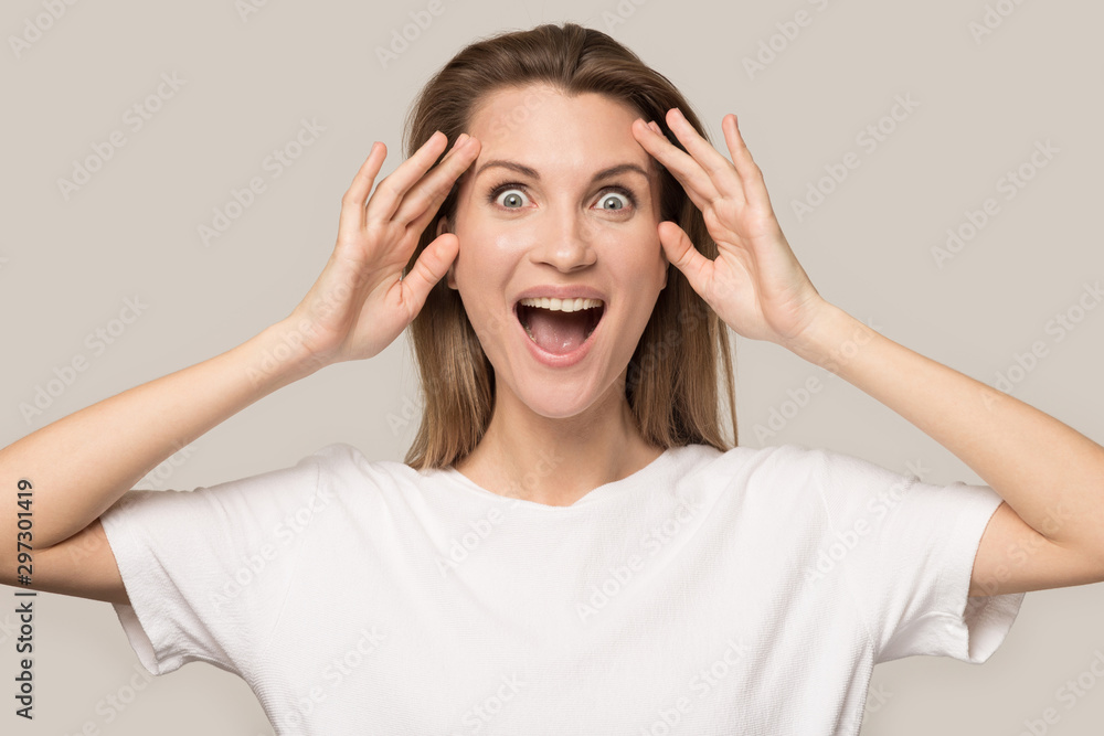 Excited Caucasian woman look at camera shocked by promotion - obrazy, fototapety, plakaty 
