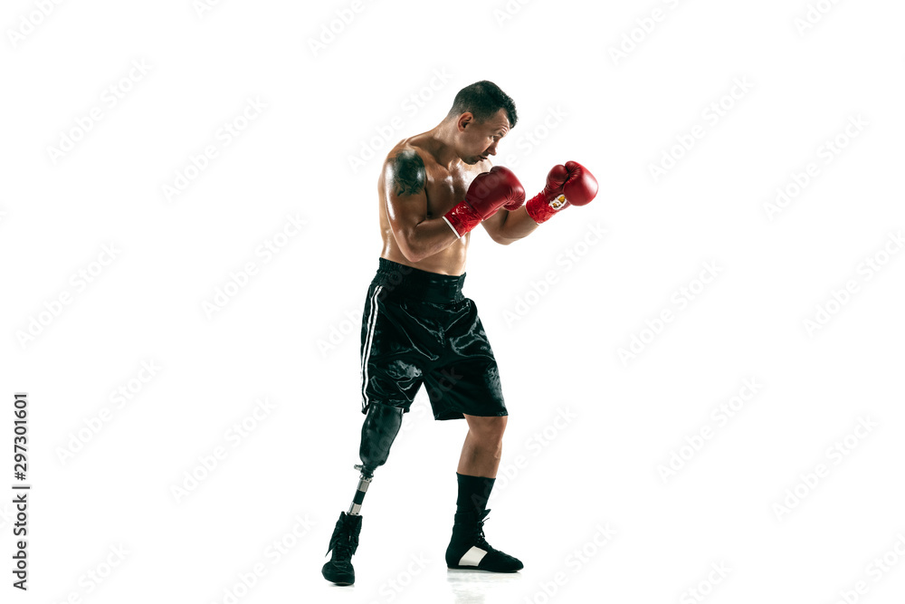 Full length portrait of muscular sportsman with prosthetic leg, copy space. Male boxer in red gloves. Isolated shot on white studio background. Full length portrait of muscular sportsman with prosthetic leg, copy space. Male boxer in red gloves. Isolated shot on white studio background.