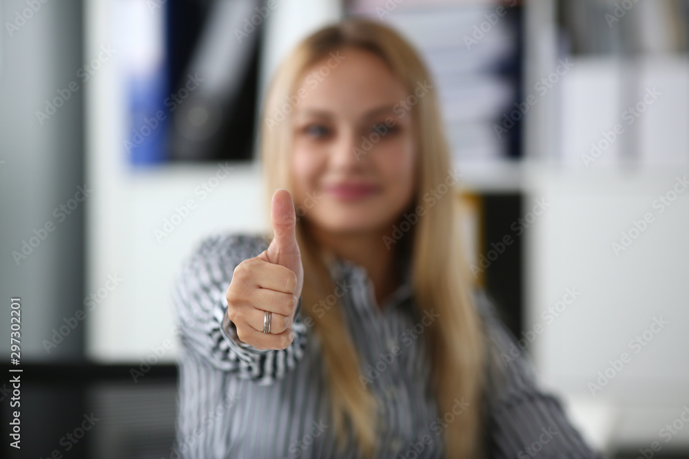 Businesslady showing approval gesture Businesslady showing approval gesture