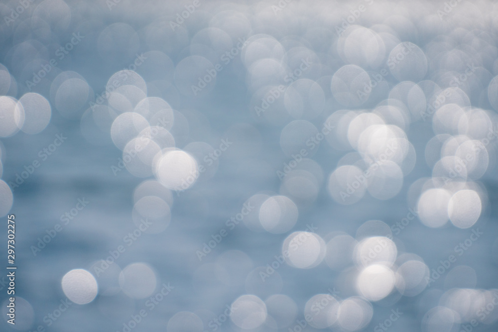Gray and white bokeh from the lake surface Gray and white bokeh from the lake surface