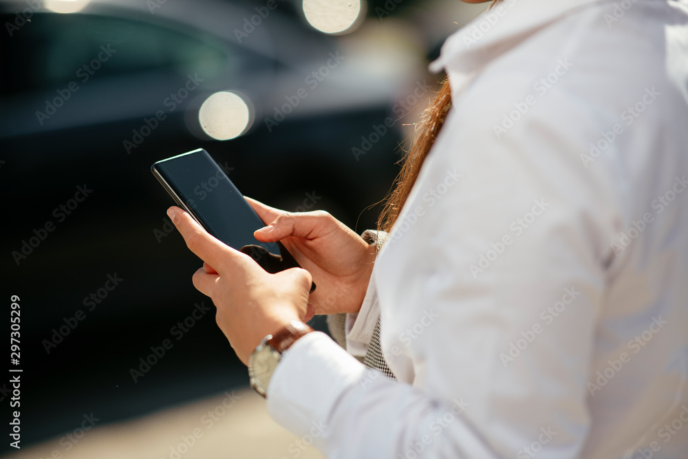 Close up of businesswoman using smartphone