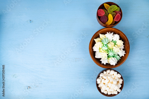 Meringue,marmalade and marshmallow in wooden bowls