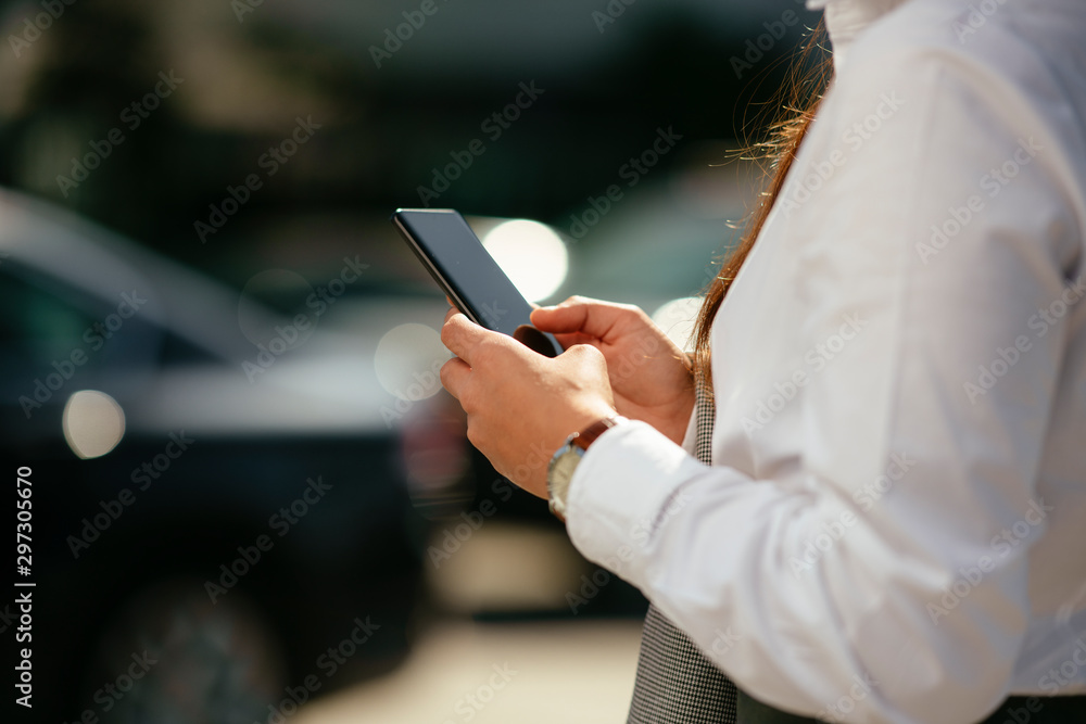 Close up of businesswoman using smartphone