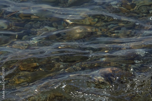coastal sea stones under vibrant clear water
