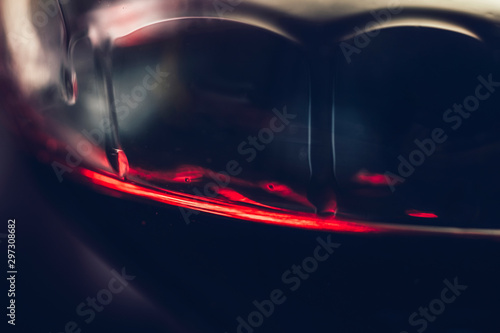 Red Wine Tears on Wine Glass, Close-up © Microgen