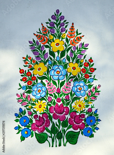 Zalipie, Polish village. Decorative motifs on the wall. The art of painting houses with floral patterns. Polish tradition handed down to generations. photo