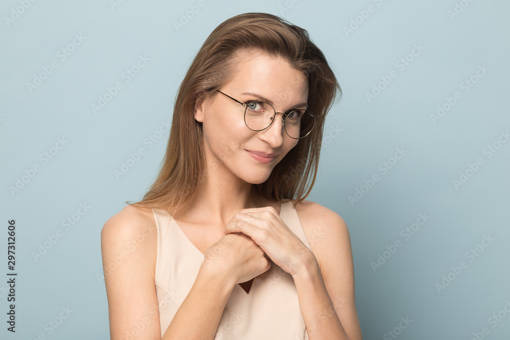 Millennial Caucasian woman posing in studio flirting with camera Millennial Caucasian woman posing in studio flirting with camera