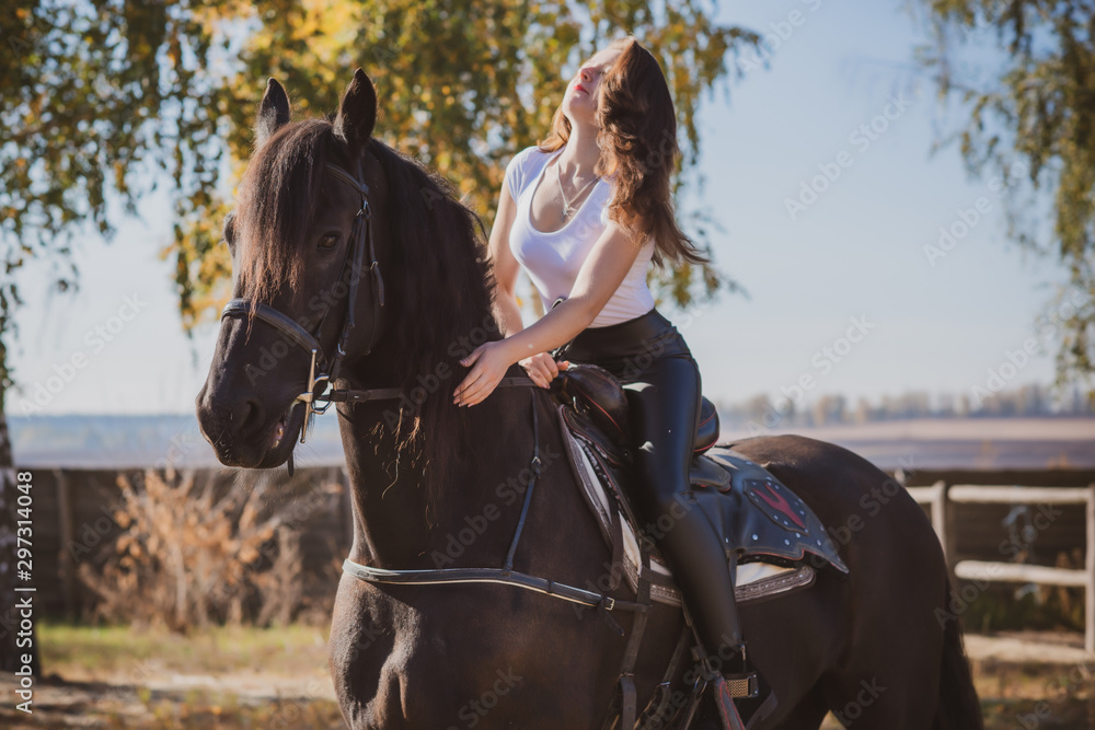 Obraz premium Rider elegant woman talking to her horse. Portrait of riding horse with woman . Equestrian horse with rider at nature