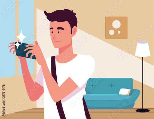 man with photographic camera in the living room