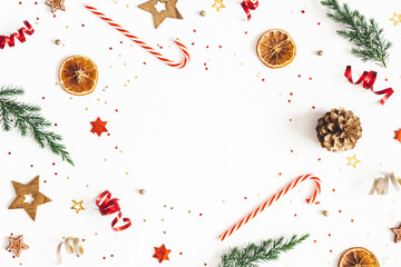Christmas composition. Fir tree branches, golden and red decorations on white background. Christmas, winter, new year concept. Flat lay, top view, copy space