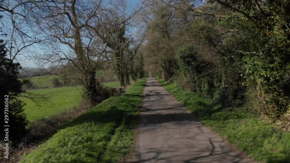 Cotswolds Wooded B-Road On Side Of Vally Zooming Out Aerial Flying Backwards 4K Cine D Cotswolds Wooded B-Road On Side Of Vally Zooming Out Aerial Flying Backwards 4K Cine D