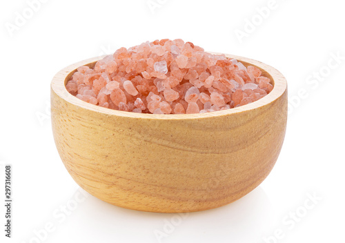 Himalayan salt raw crystals in wood bowl Isolated on white background