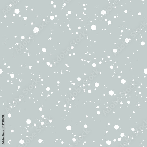 Snowfall on blue pastel background. Christmas and New Year seamless vector pattern