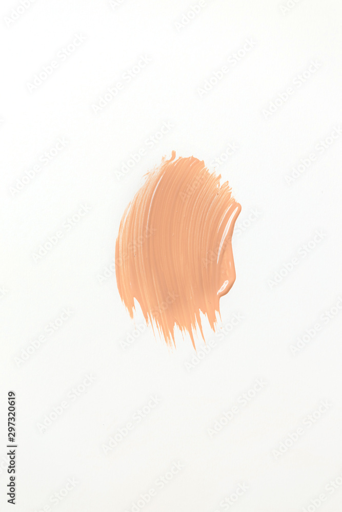 Fototapeta premium Beige skin tone smudge on white background